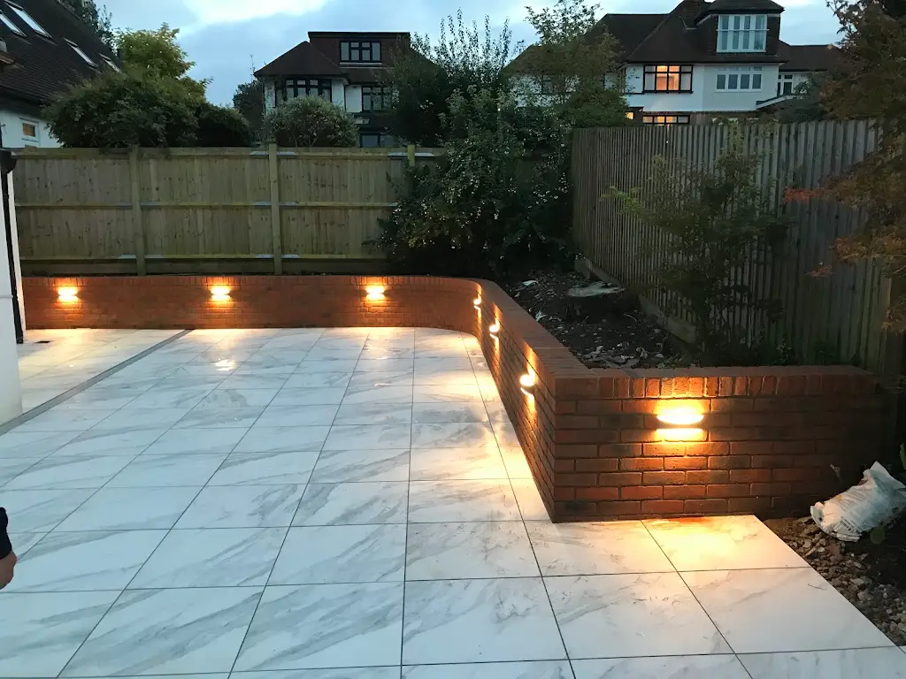 Landscaped patio with brickwork and integrated garden lighting